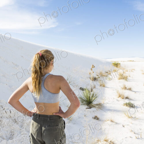 A teenage girl in the open landscape of White Sands Nat'l Monument, NM A teenage girl in the open landscape of White Sands Nat'l Monument, NM