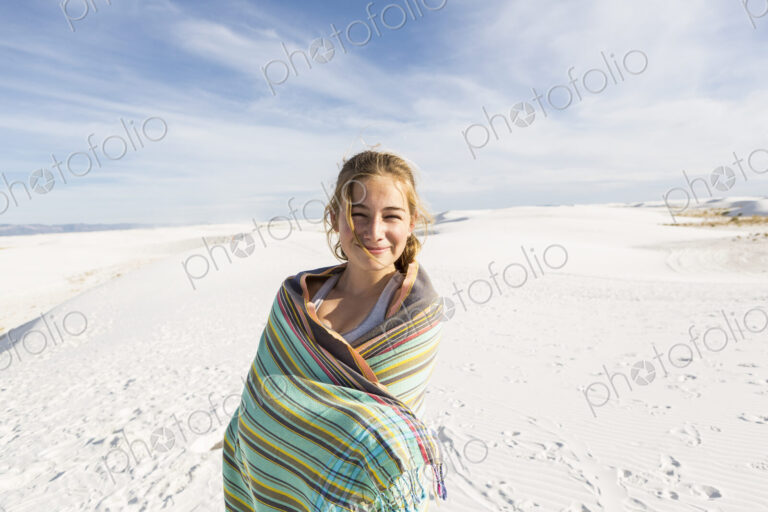 A teenage girl in the open landscape of White Sands Nat'l Monument, NM
