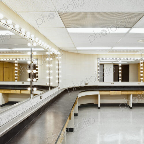 A theatre dressing room with a long worktop and seats and big mirrors with bulb… A theatre dressing room with a long worktop and seats and big mirrors with bulb…