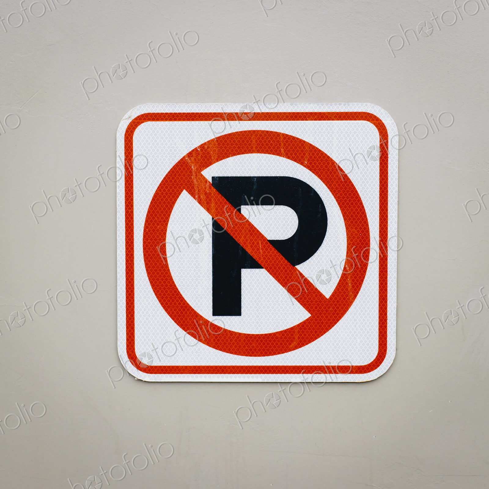 A traffic sign, No Parking sign.