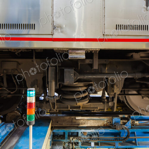 A train, the wheels and low section of a train carriage on rails. A train, the wheels and low section of a train carriage on rails.