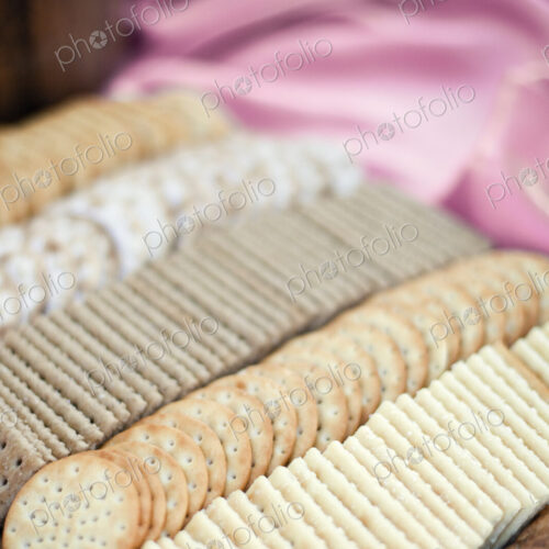 A tray of cheese crackers and biscuits laid out. A choice of shapes and flavours. A tray of cheese crackers and biscuits laid out. A choice of shapes and flavours.