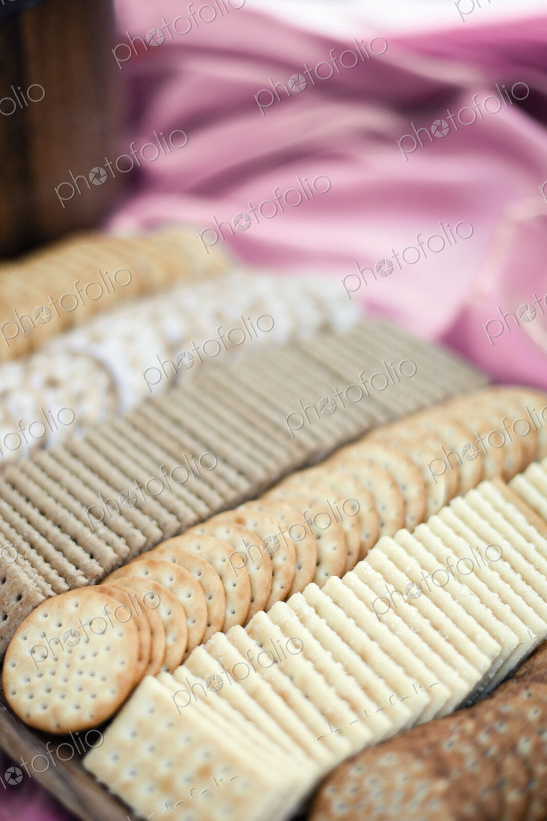 A tray of cheese crackers and biscuits laid out. A choice of shapes and flavours.