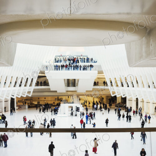 A view across the central atrium of the transport hub building, people using the World…