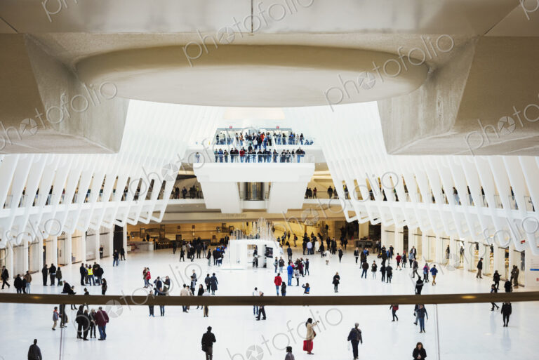 A view across the central atrium of the transport hub building, people using the World…