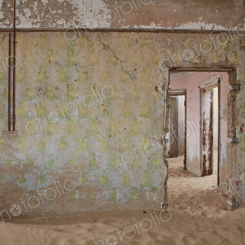 A view of a room in a derelict building full of sand. A view of a room in a derelict building full of sand.
