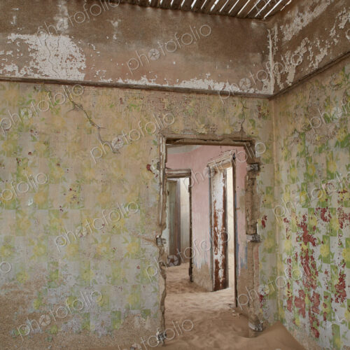 A view of a room in a derelict building full of sand. A view of a room in a derelict building full of sand.