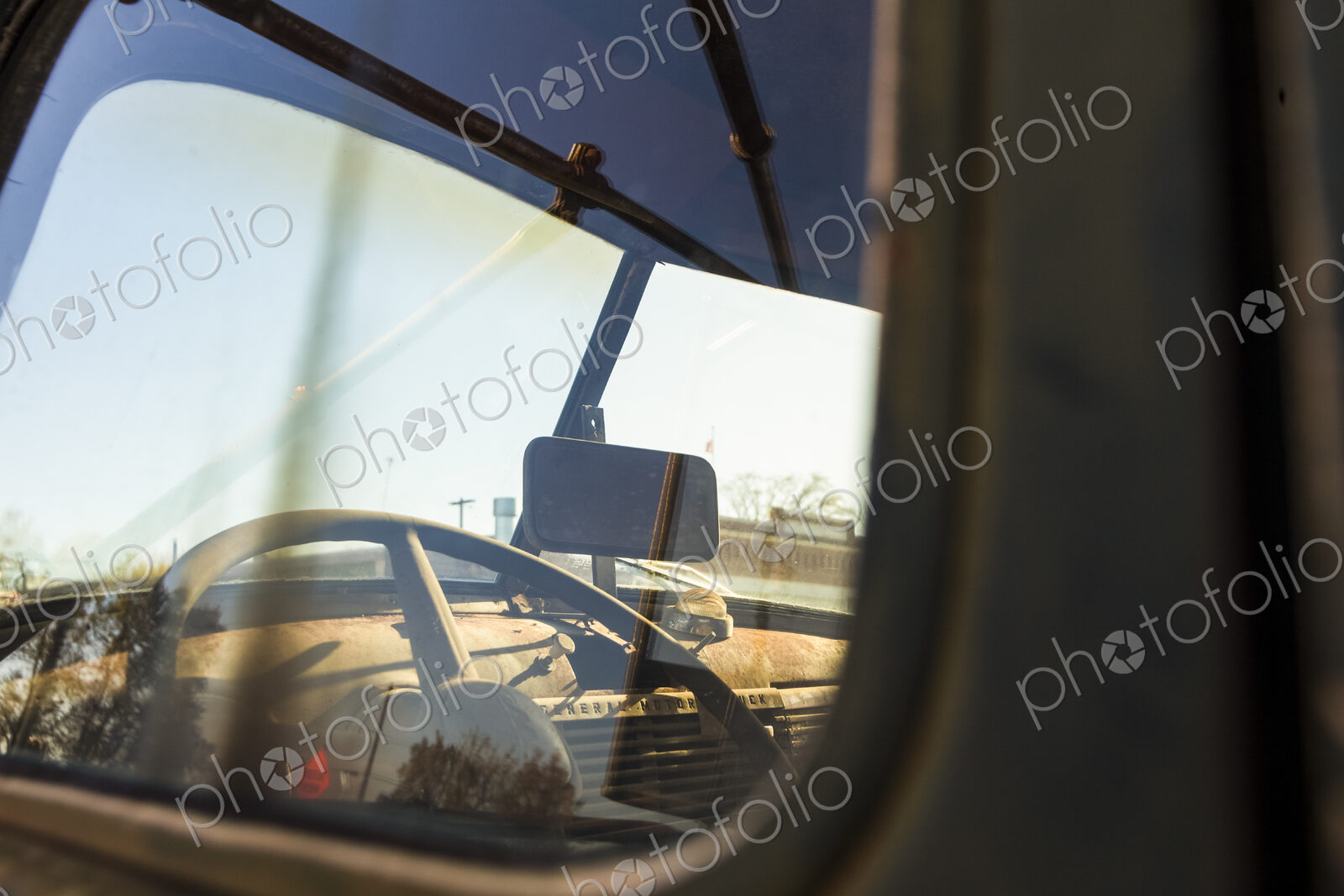 A vintage truck, with a view into the driver’s cab.