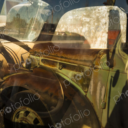 A vintage truck, with into the driver's cab.