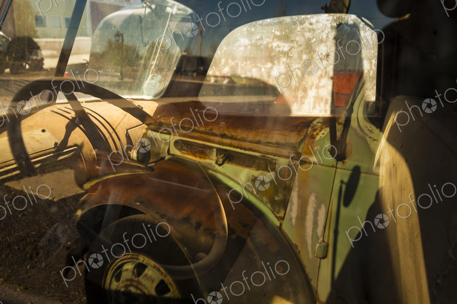 A vintage truck, with into the driver’s cab.