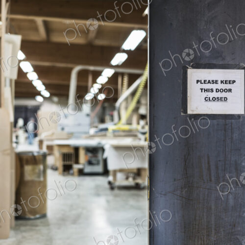 A walkway between two shops in a large woodworking factory. A walkway between two shops in a large woodworking factory.