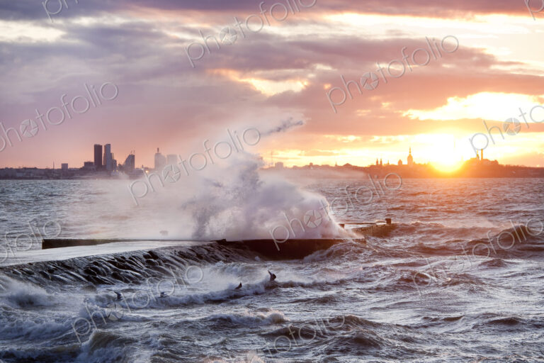 A weather storm in the Baltic Sea, waves crashing over a pier