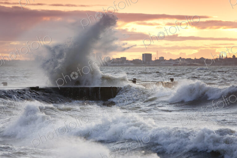 A weather storm in the Baltic Sea, waves crashing over a pier
