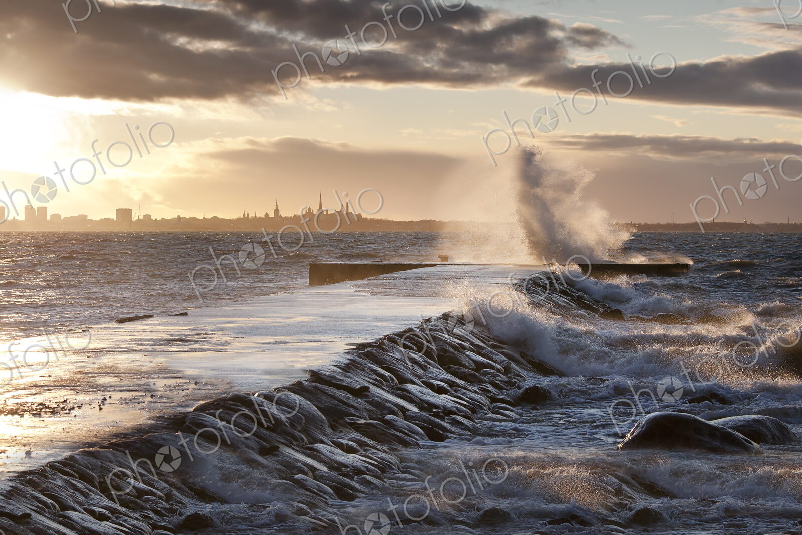 A weather storm in the Baltic Sea, waves crashing over a pier
