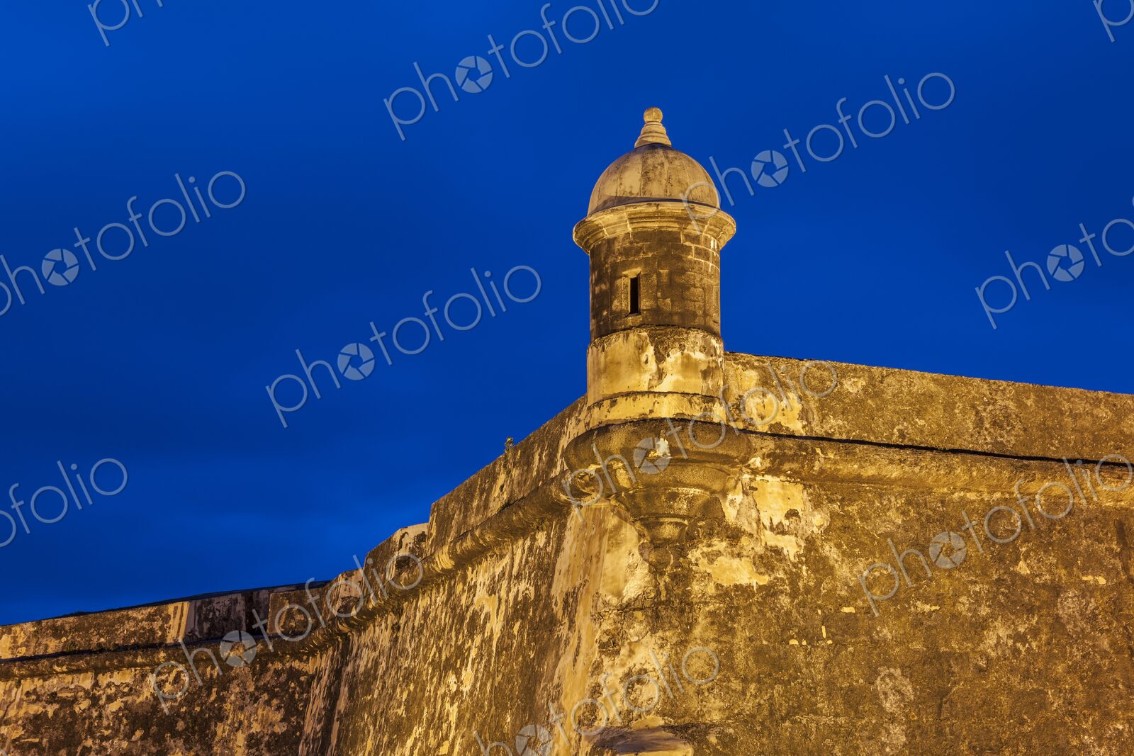 A well-preserved sentry box stands watch atop the fortified walls of Castillo San…