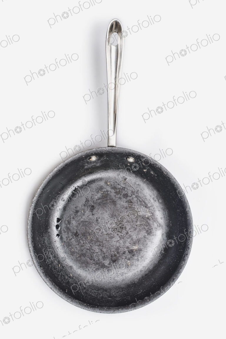 A well seasoned frying pan, with a smooth cooking surface.