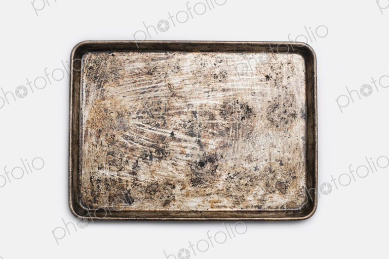A well used, seasoned baking tray. Cookware. Baking sheet.