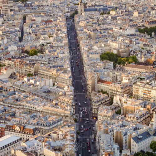 A wide city boulevard in the centre of Paris, road with traffic A wide city boulevard in the centre of Paris, road with traffic