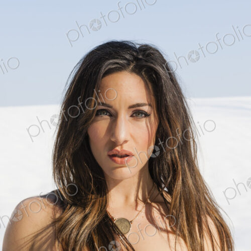 A woman outdoors in the snow. A woman outdoors in the snow.