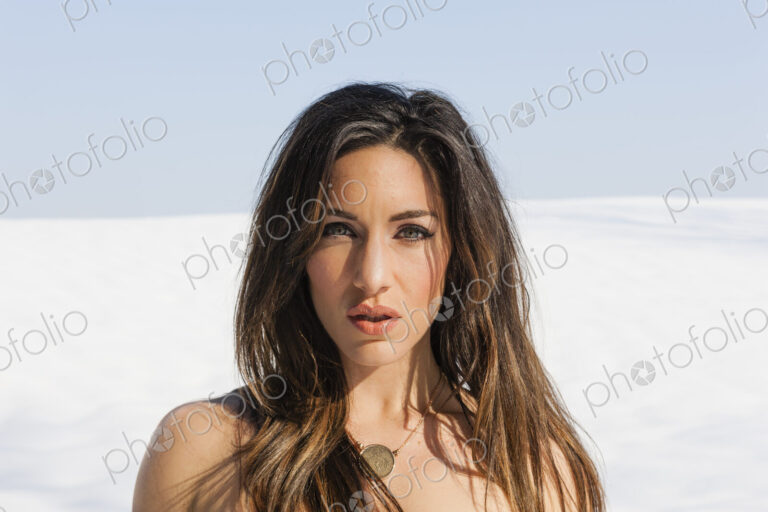 A woman outdoors in the snow.