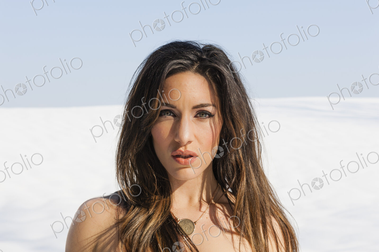 A woman outdoors in the snow.