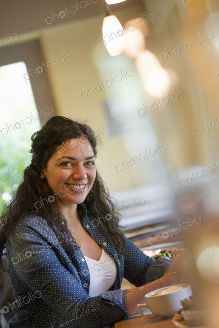A woman seated in a cafe