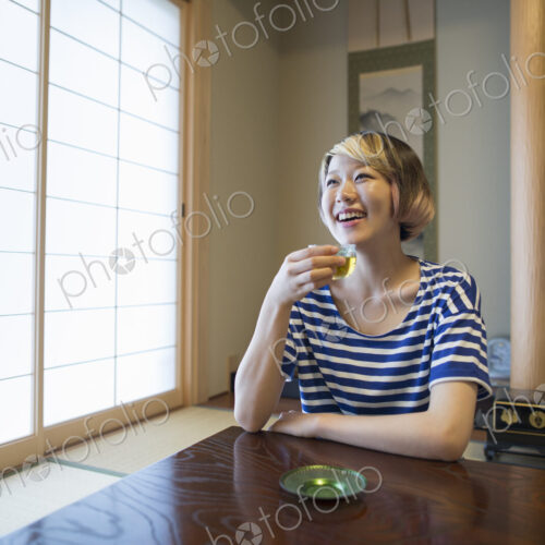 A woman sitting at a table. A woman sitting at a table.