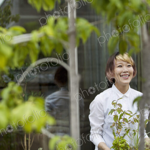 A woman standing in her garden. A woman standing in her garden.