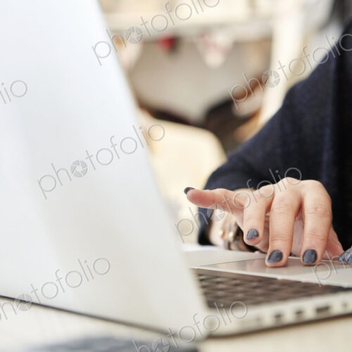 A woman using a laptop.