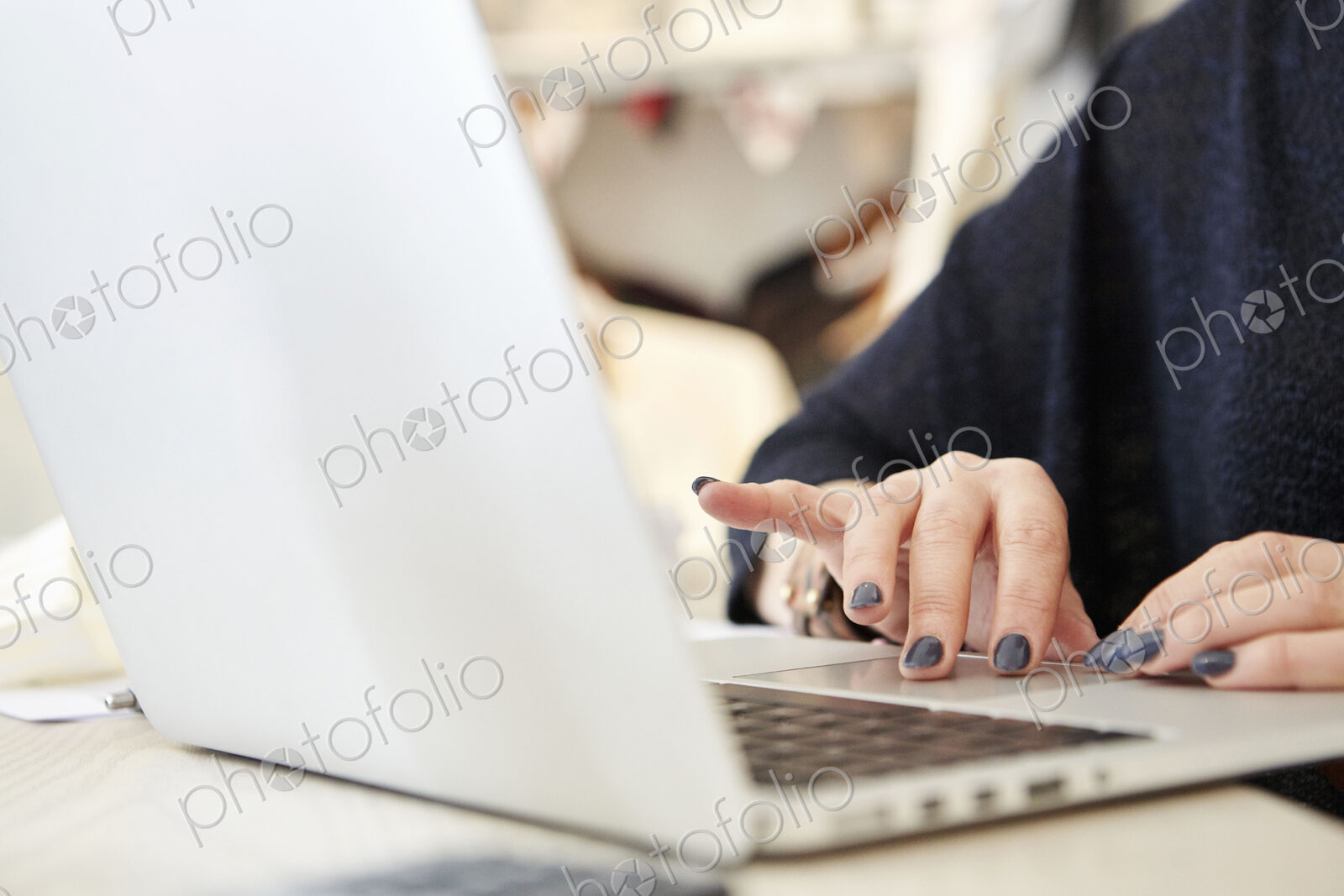A woman using a laptop.