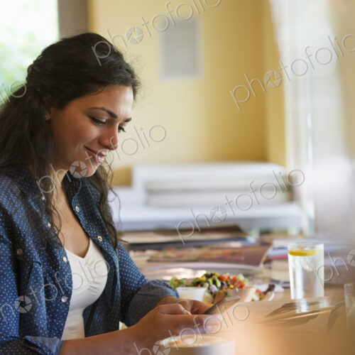 A woman using a smart phone. A woman using a smart phone.