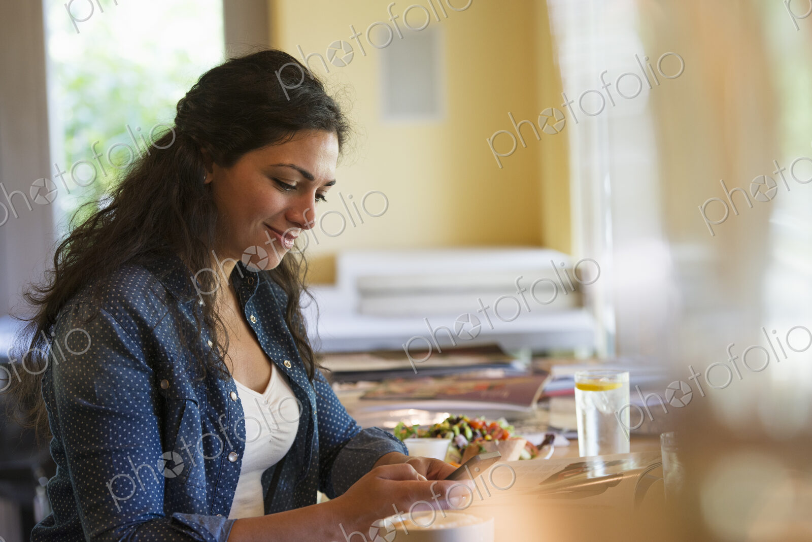 A woman using a smart phone.