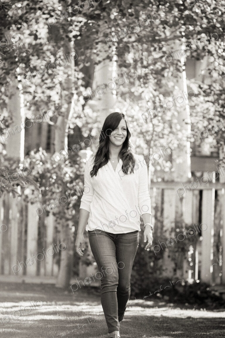 A woman walking along a road.