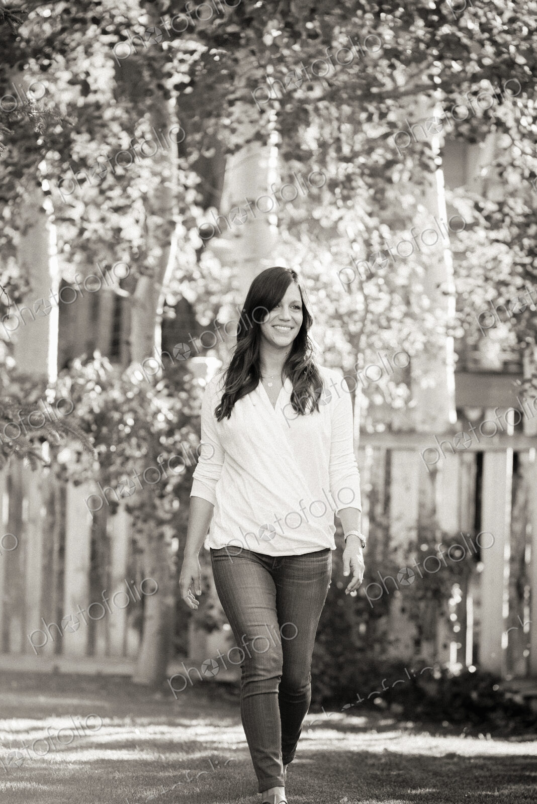 A woman walking along a road.