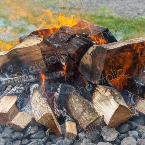 A wood fire with flames. A wood fire with flames.