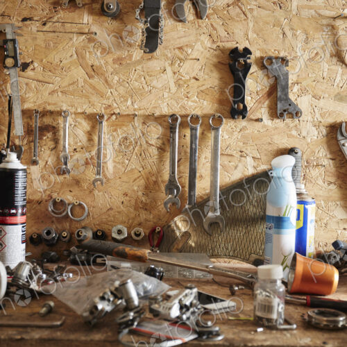 A workbench and tool board in a cycle repair shop. A workbench and tool board in a cycle repair shop.
