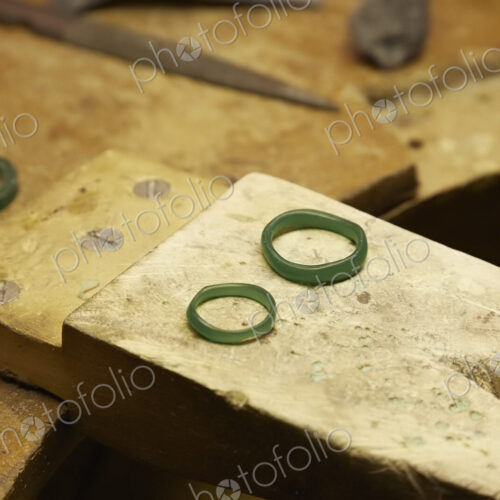 A workbench with three rings in a green material. A workbench with three rings in a green material.