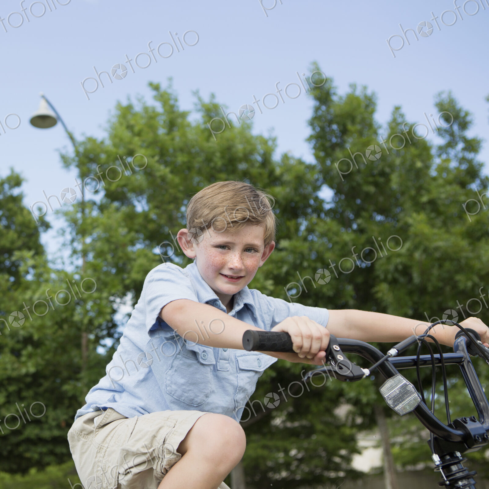 A young boy riding a bicycle.