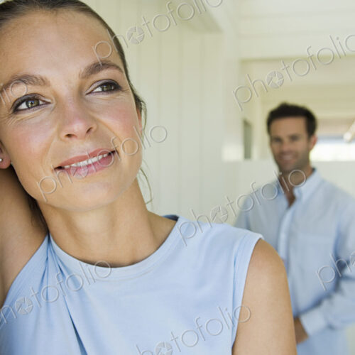 A young couple, a woman and a man at home. A young couple, a woman and a man at home.