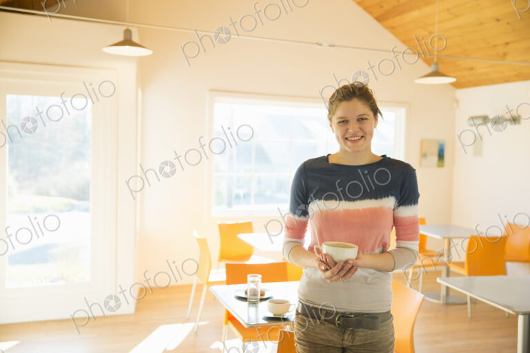 A young girl in a coffee shop.
