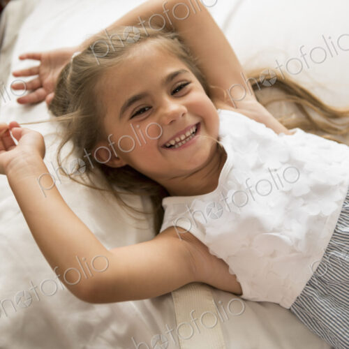 A young girl looking at the camera, smiling. A young girl looking at the camera, smiling.