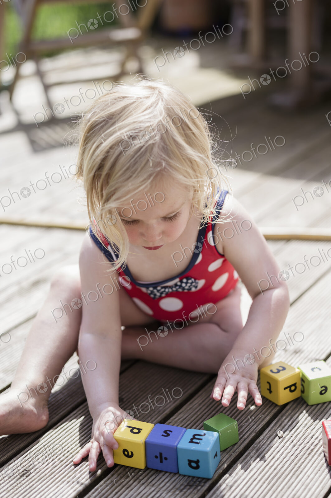 A young girl playing outdoors.