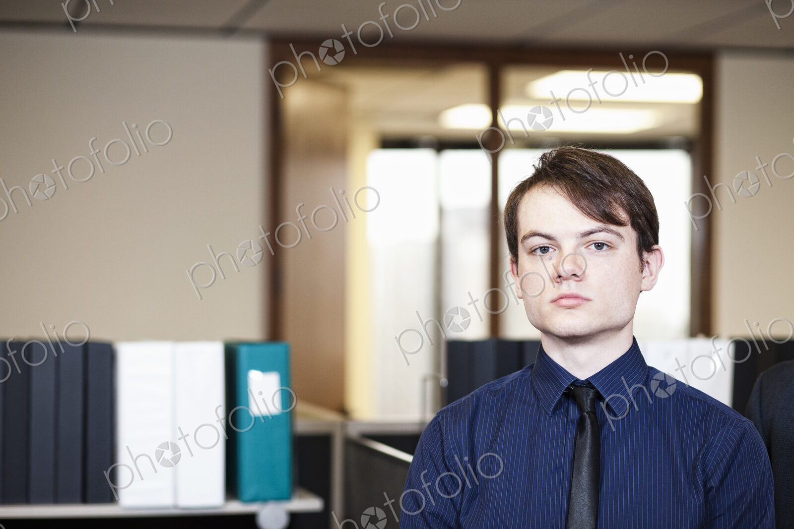 A young hip caucasian businessman in a shirt and tie.