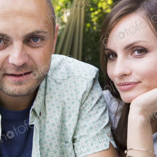 A young man and woman, a couple together at a cafe.