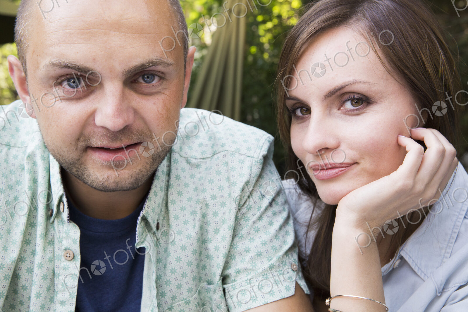 A young man and woman, a couple together at a cafe.