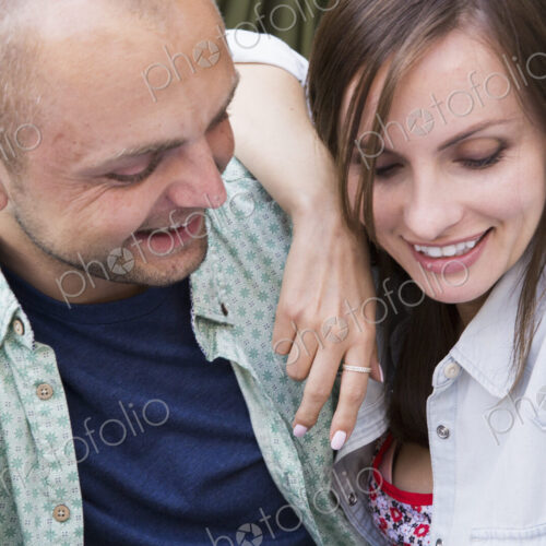 A young man and woman, a couple together at a cafe.