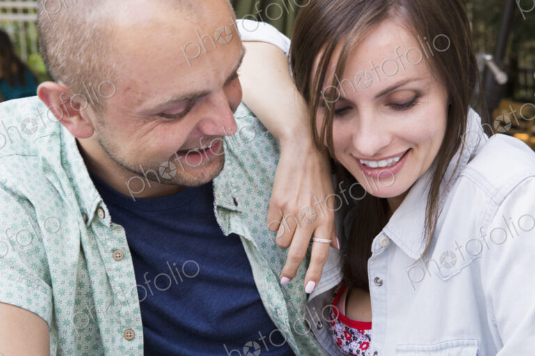 A young man and woman, a couple together at a cafe.