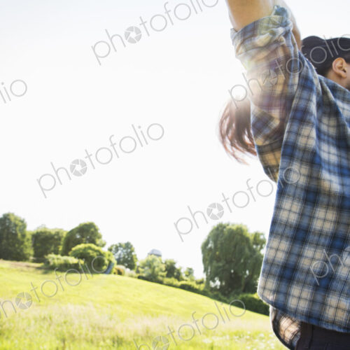 A young man letting down his very long dark hair. A young man letting down his very long dark hair.