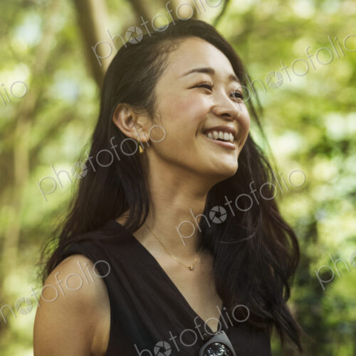 A young woman in woodland, outdoors. A young woman in woodland, outdoors.