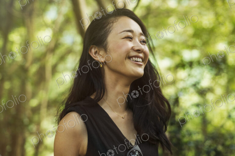 A young woman in woodland, outdoors.
